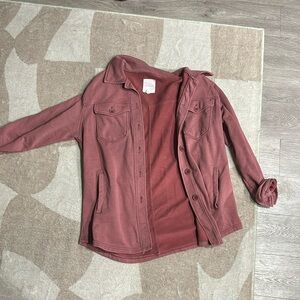 Red button down. It’s a little lighter than a shacket. Size L.
